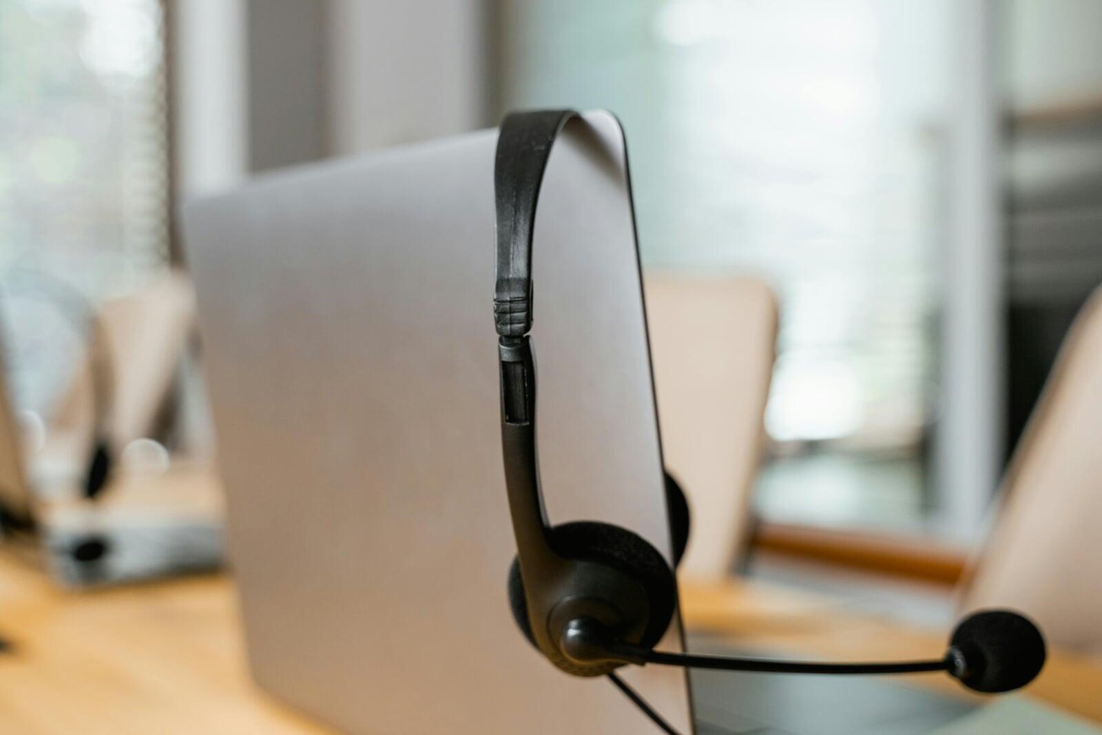 Photo by MART  PRODUCTION: https://www.pexels.com/photo/close-up-shot-of-headphones-hanging-on-a-laptop-7709217/